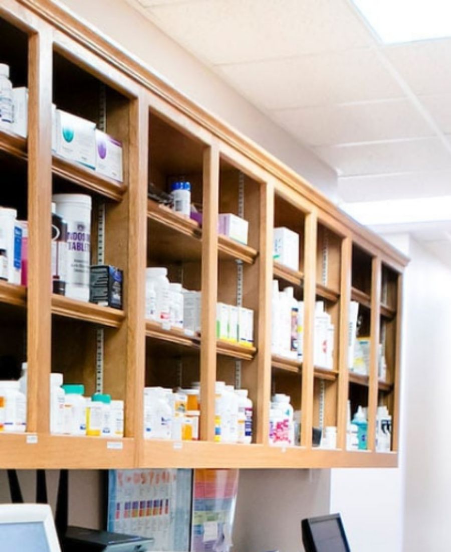 Pharmacy shelves filled with various medicine